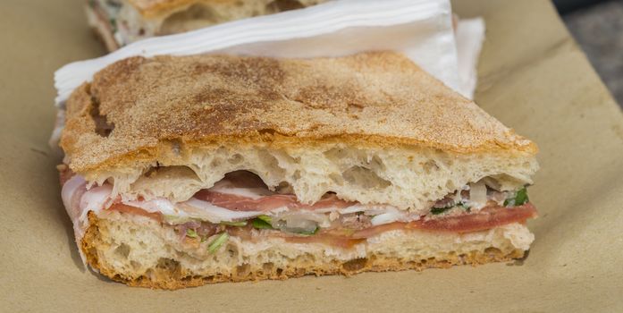 traditional Italian foccacia stuffing with cheese ham herbs and tomato