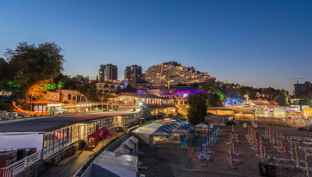 ODESSA, UKRAINE - 08.08.2018. Panoramic view of Arcadia city beach in a hot summer night. Famous touristic place in Ukraine