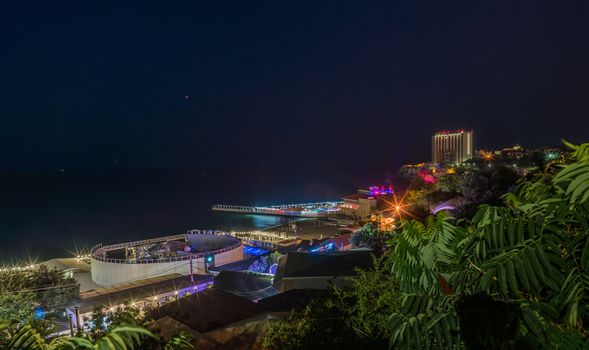 ODESSA, UKRAINE - 08.08.2018. Panoramic view of Arcadia city beach in a hot summer night. Famous touristic place in Ukraine