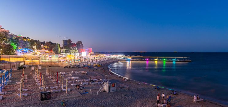 ODESSA, UKRAINE - 08.08.2018. Panoramic view of Arcadia city beach in a hot summer night. Famous touristic place in Ukraine