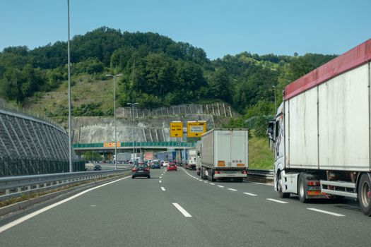 Macelj, Gruskovje - Border Slovenia and Croatia, July 9 2018: Cars, buses and trucks waiting to cross from Croatia to Slovenia in summer. Due Schengen regime controls on Slovene side are stricter.