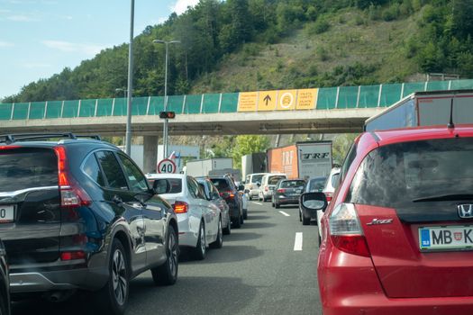 Macelj, Gruskovje - Border Slovenia and Croatia, July 9 2018: Cars, buses and trucks waiting to cross from Croatia to Slovenia in summer. Due Schengen regime controls on Slovene side are stricter.