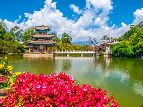 Black Dragon Pool and Moon Embracing Pavilion on sunny day, Lijiang, Yunnan Province, China.