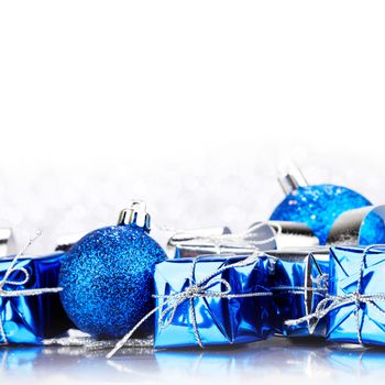 Christmas gifts and decoration on shiny glitter background