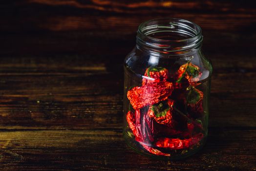 Jar of Dried Red Chilii Peppers. Copy space.