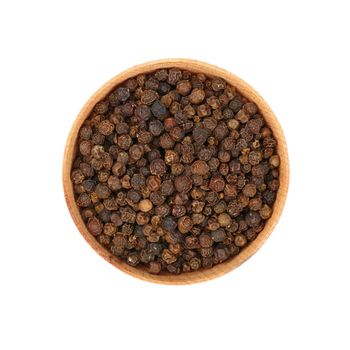 Close up one wooden bowl full of black pepper peppercorns isolated on white background, elevated top view, directly above