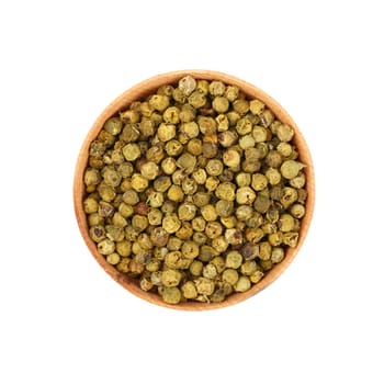 Close up one wooden bowl full of green pepper peppercorns isolated on white background, elevated top view, directly above