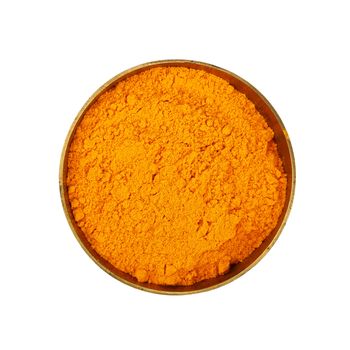 Close up one bronze metal bowl full of yellow turmeric powder spice isolated on white background, elevated top view, directly above