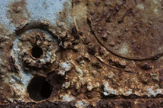 Corroded iron textue with holes.