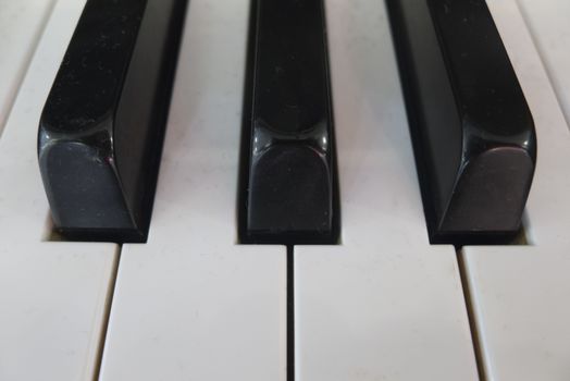 Close up of piano musical instrument keys.