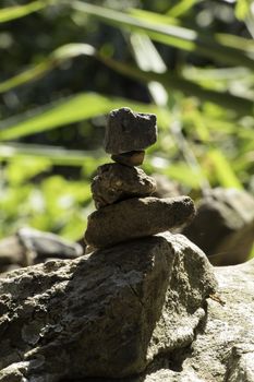 Stone Balancing in forest on daylight close up