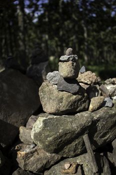 Stone Balancing in forest on daylight among the others 