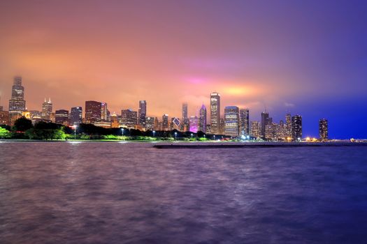 The Chicago skyline at night after a storm across Lake Michigan.