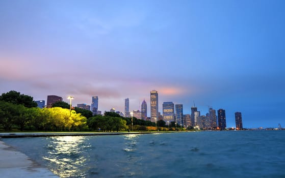 The Chicago skyline at night after a storm across Lake Michigan.