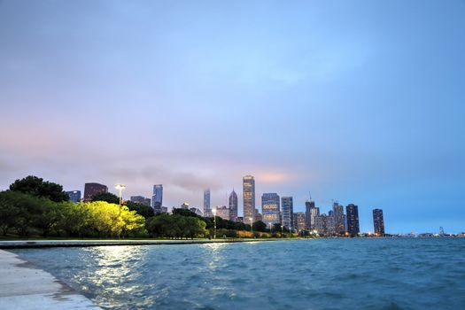 The Chicago skyline at night after a storm across Lake Michigan.