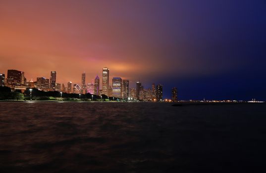 The Chicago skyline at night after a storm across Lake Michigan.