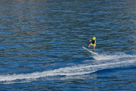 Little boy Wakeboarding on summer sea