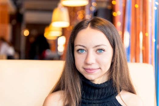 Portrait of a beautiful girl with expressive eyes in a close-up