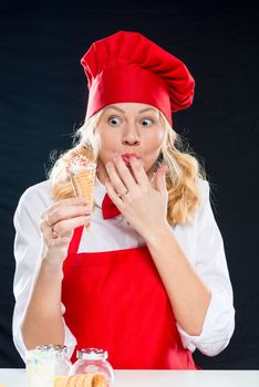 A woman cook looks at tasty homemade ice cream