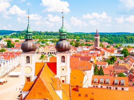Aerial view of Telc with main square and towers of church of the Holy Name of Jesus, Czech Republic. UNESCO World Heritage Site.