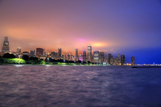 Chicago, Illinois, USA - June 22, 2018 - The Chicago skyline at night after a storm across Lake Michigan.