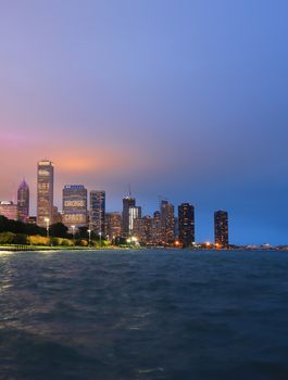 Chicago, Illinois, USA - June 22, 2018 - The Chicago skyline at night after a storm across Lake Michigan.