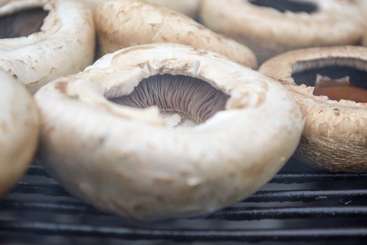 Tasty mushrooms grilled outside. Small depth of field