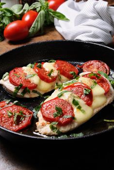 Langet from chicken breast with tomato and mozzarella. A-la caprese.