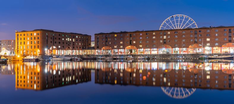 Panoramic Sunset dusk at UNESCO world heritage site the Royal Albert Dock Liverpool at Pier head in Liverpool England UK.
