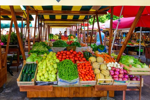 Zadar - July 3 2018: Local producers and merchants offering fresh local grown fruits and vegetables on the market. Due good climate conditions a variety of fresh products is available.