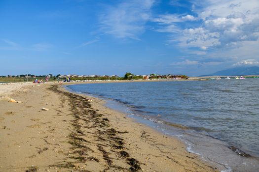 Footprints in sand along the famous Queens Beach in Nin near Zadar, Croatia. Rare sand beach in the Adriatic sea