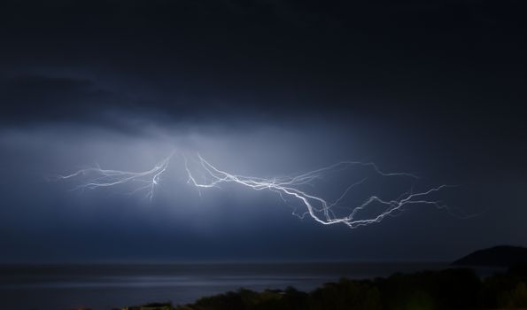 lightning and storm on the sea at night