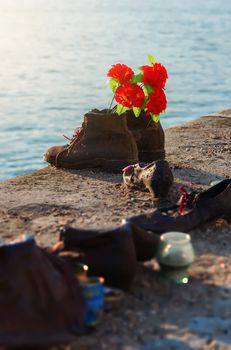 Shoes on waterfront of Danube river in Budapest, Hungary