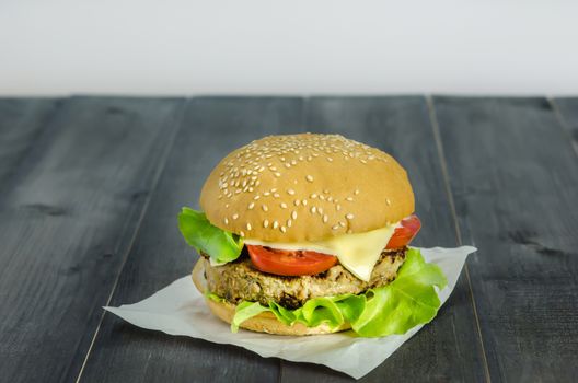 Closeup of home made burgers on wooden background