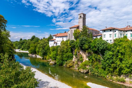 Cividale del Friuli, Italy - Aug 14 2018: View of the old city center with traditional architecture and River Natisone on a summer day