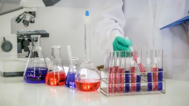 scientist with equipment and science experiments in laboratory