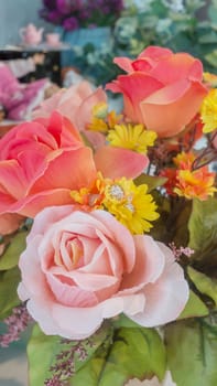 colorful of the plastic flowers bouquet , soft of focus