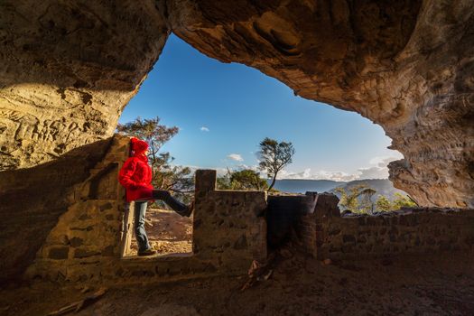 Standing in a cave at cliff edge in the upper Blue Mountains Australia