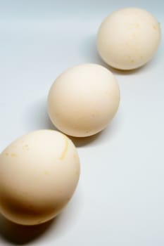 Three eggs isolated over a white background cutout.