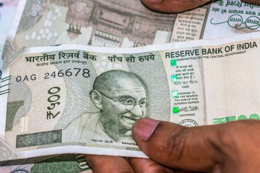 Selective Focus. Profit from business. Texture and background new 500 Indian rupee currency ready for business investment. Corruption clampdown of Indian government with new series of Indian Rupee.