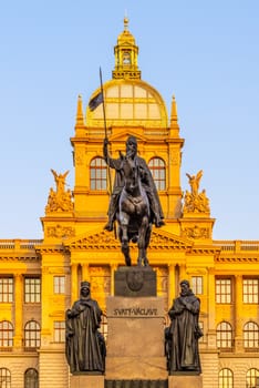The bronze equestrian statue of St Wenceslas at the Wenceslas Square with historical Neorenaissance building of National Museum in Prague, Czech Republic.