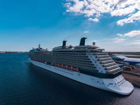 Big white passenger ship moored at the cargo port