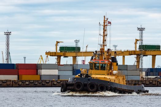 Tug ship in the cargo port of Riga, Europe