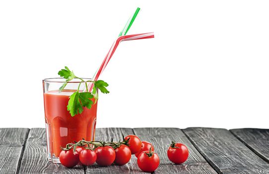 Cherry tomatoes with a glass of tomato juice. A cocktail stick and leaf parsley in a glass. Isolated on white background.