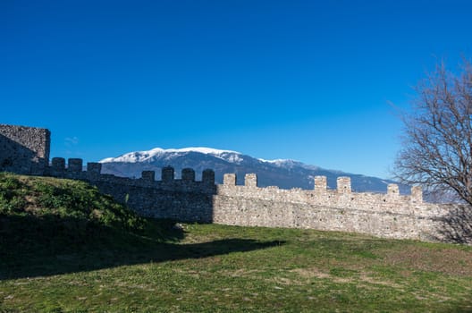 Wall of medieval castle of Platamonas with Olympus mountain at background. Pieria,  Greece