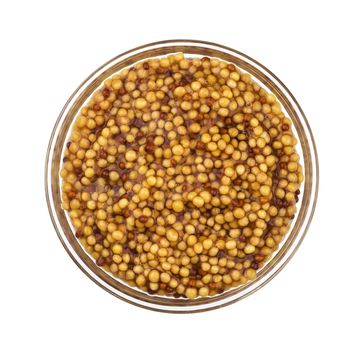 French mustard. Splashes and spilled mustard seeds sauce isolated on white background with clipping path, top view