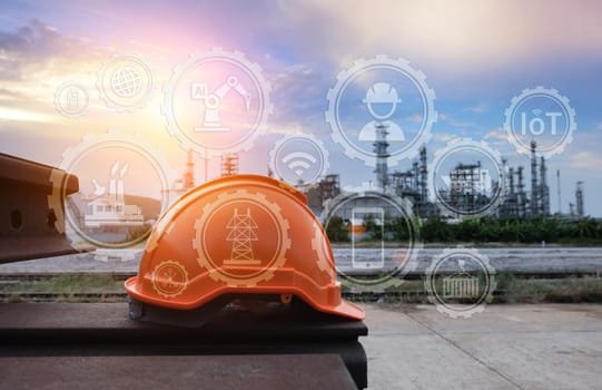 Helmet construction on the metal bar with industrial background.