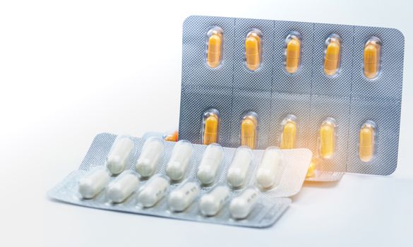 Cefixime and azithromycin capsule in blister pack for treatment gonorrhea. Neisseria Gonorrhoeae treatment. Antibiotic drug resistance. Orange and white pill. Sexually Transmitted Diseases concept. Pharmaceutical industry. Pharmacy background.