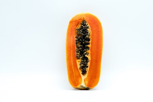 Half of ripe papaya fruit with seeds isolated on white background with copy space. Natural source of vitamin C, folate and minerals. Healthy food for pregnant and breast feeding woman