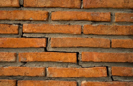 Orange brick wall texture background with copy space for text.